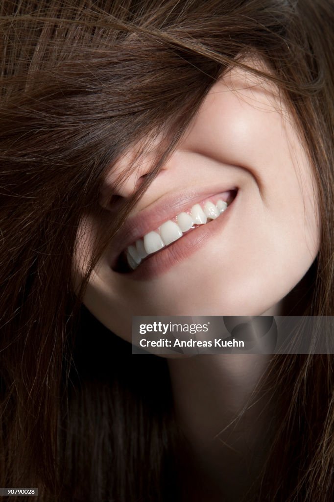 Young woman with happy smile, close up.