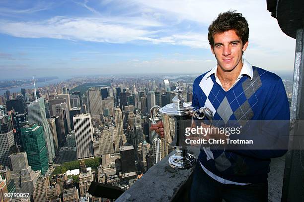 Juan Martin Del Potro the 2009 US Open Tennis Champion poses with the US Open trophy on a viewing deck at the Empire State Building on September 15,...