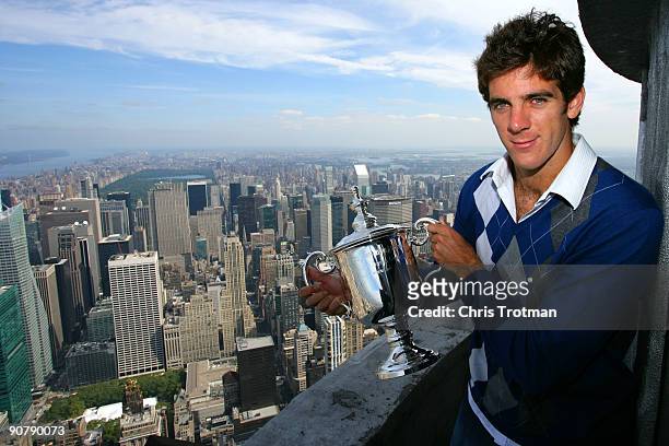 Juan Martin Del Potro the 2009 US Open Tennis Champion poses with the US Open trophy on a viewing deck at the Empire State Building on September 15,...