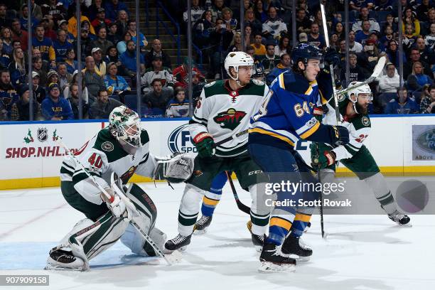 Devan Dubnyk and Jonas Brodin of the Minnesota Wild defend the net against Sammy Blais of the St. Louis Blues at Scottrade Center on November 25,...