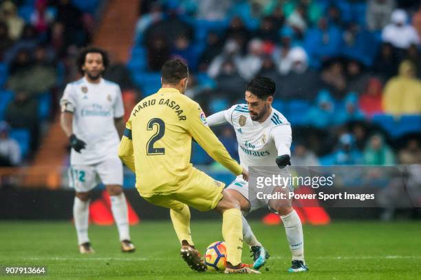 Isco Alarcon of Real Madrid competes for the ball with Mario Gaspar Perez Martínez of Villarreal CF during the La Liga 2017-18 match between Real...
