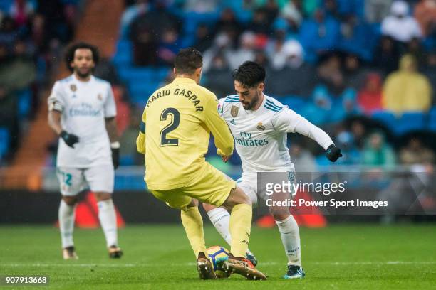 Isco Alarcon of Real Madrid competes for the ball with Mario Gaspar Perez Martínez of Villarreal CF during the La Liga 2017-18 match between Real...