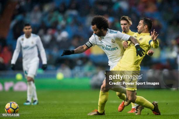 Marcelo Vieira Da Silva of Real Madrid competes for the ball with Mario Gaspar Perez Martínez of Villarreal CF during the La Liga 2017-18 match...