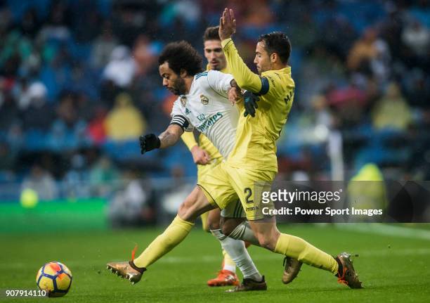 Marcelo Vieira Da Silva of Real Madrid competes for the ball with Mario Gaspar Perez Martínez of Villarreal CF during the La Liga 2017-18 match...