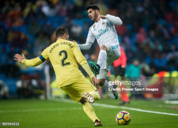 Marco Asensio Willemsen of Real Madrid vies for the ball with Mario Gaspar Perez Martínez of Villarreal CF during the La Liga 2017-18 match between...