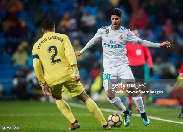 Marco Asensio Willemsen of Real Madrid competes for the ball with Mario Gaspar Perez Martínez of Villarreal CF during the La Liga 2017-18 match...