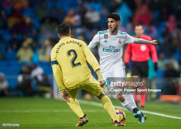 Marco Asensio Willemsen of Real Madrid competes for the ball with Mario Gaspar Perez Martínez of Villarreal CF during the La Liga 2017-18 match...