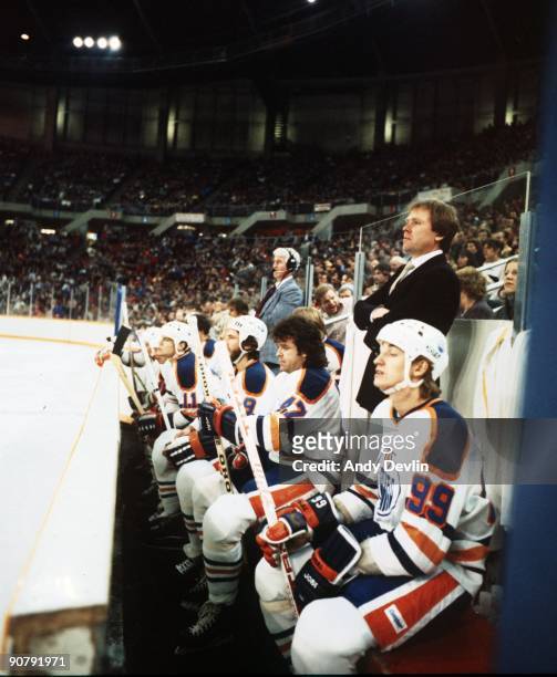 Mark Messier, Glen Anderson, Don Murdoch, Head Coach Glen Sather and Wayne Gretzky of the Edmonton Oilers look on from the bench area during an NHL...