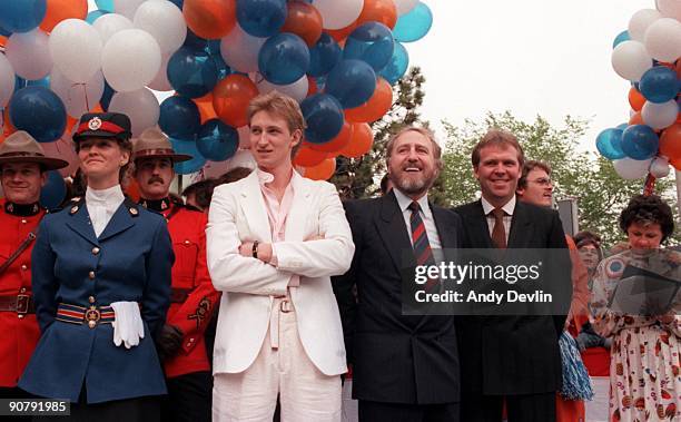 Head Coach Glen Sather, owner Peter Pocklington and Wayne Gretzky of the Edmonton Oilers look on during a parade to celebrate their Stanley Cup...