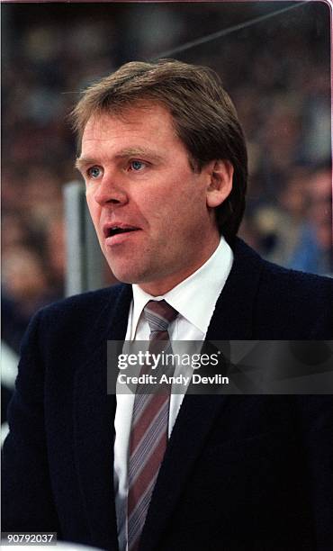 Head Coach Glen Sather of the Edmonton Oilers looks on from the bench area during an NHL game circa 1982-83 in Edmonton, Alberta, Canada.