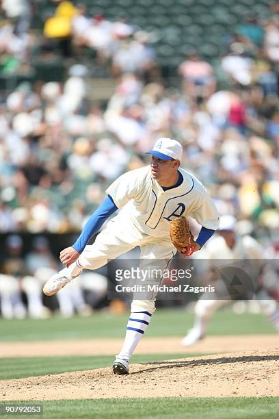 Michael Wuertz of the Oakland Athletics pitching during the game against the Chicago White Sox during the 1929-themed turn back the clock game at the...