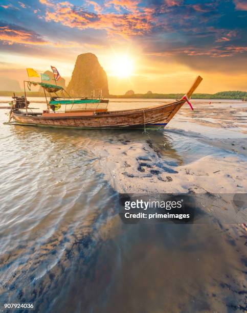 beautiful sunset at tropical sea with long tail boat in south thailand - thailand stock pictures, royalty-free photos & images