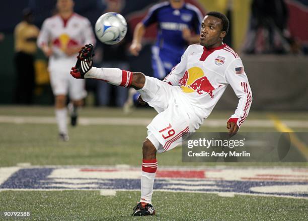 Dane Richards of the New York Red Bulls plays the ball against the Kansas City Wizards during their game at Giants Stadium on September 12, 2009 in...