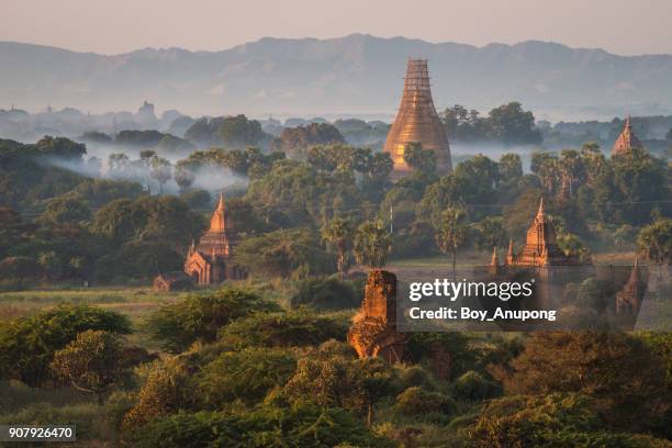 the scenery view of bagan plain during the sunrise and most of the temple is still repairing after damaged from the 2016 big earthquake. - bagan temples damaged in myanmar earthquake stock pictures, royalty-free photos & images