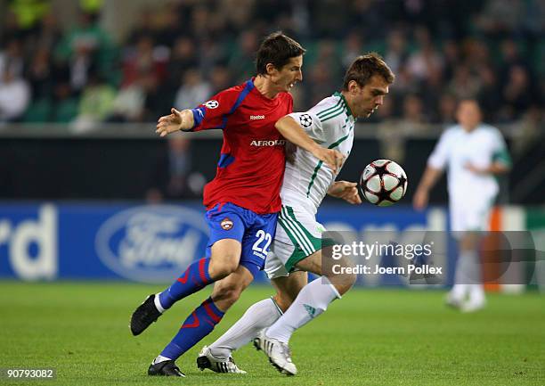 Zvjezdan Misimovic of Wolfsburg and Evgeniy Aldonin of Moscow battle for the ball during the UEFA Champions League Group B match between VfL...