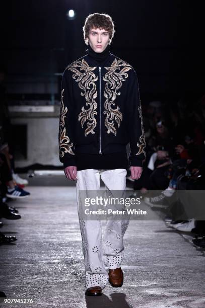 Mikolaj Kajak walks the runway during the Dries Van Noten Menswear Fall/Winter 2018-2019 show as part of Paris Fashion Week on January 18, 2018 in...