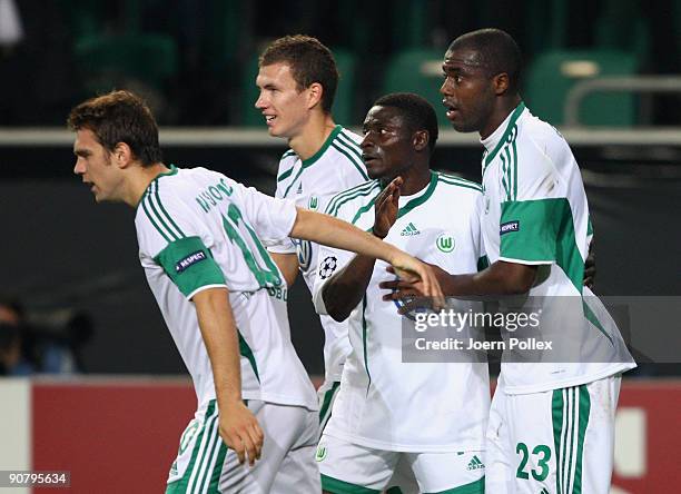 Grafite of Wolfsburg celebrates with his team mates after scoring his team's second goal during the UEFA Champions League Group B match between VfL...