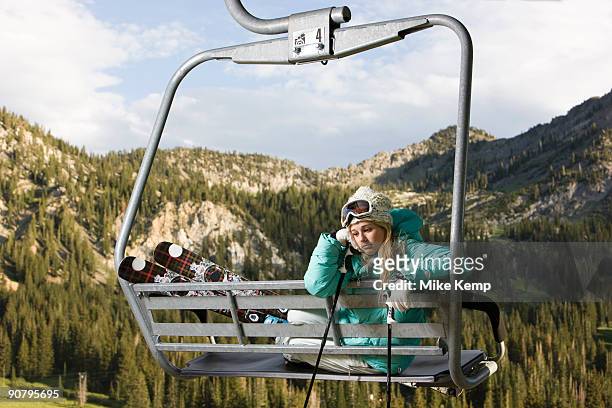 skier on a ski lift during the summer - alta utah stock pictures, royalty-free photos & images