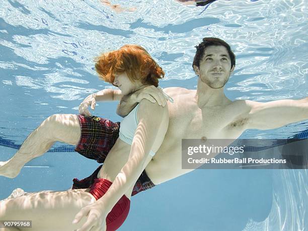 man saving a woman from drowning - drowning stock pictures, royalty-free photos & images