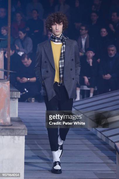 Model walks the runway during the Ami - Alexandre Mattiussi Menswear Fall/Winter 2018-2019 show as part of Paris Fashion Week on January 18, 2018 in...