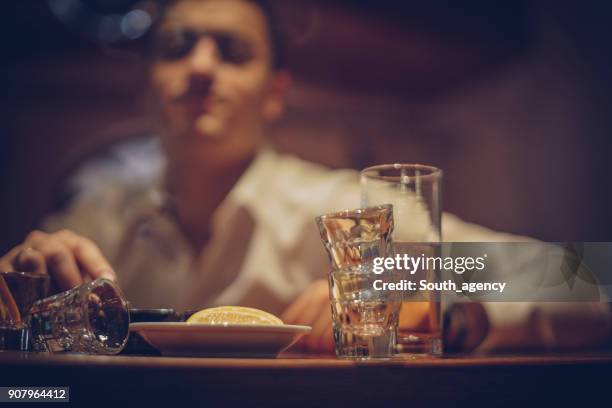 man in pub - binge drinking stock pictures, royalty-free photos & images