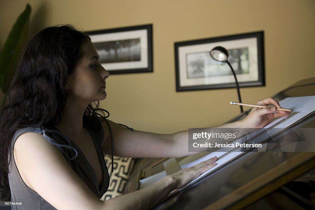Woman at a drafting table
