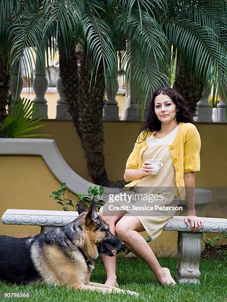 woman outdoors with her dog - german shepherd sitting stock pictures, royalty-free photos & images