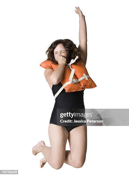 woman in a black swimsuit - 鼻をつまむ ストックフォトと画像