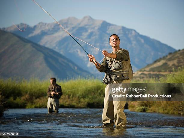 fly fisherman fishing in a mountain river - wading boots stock pictures, royalty-free photos & images