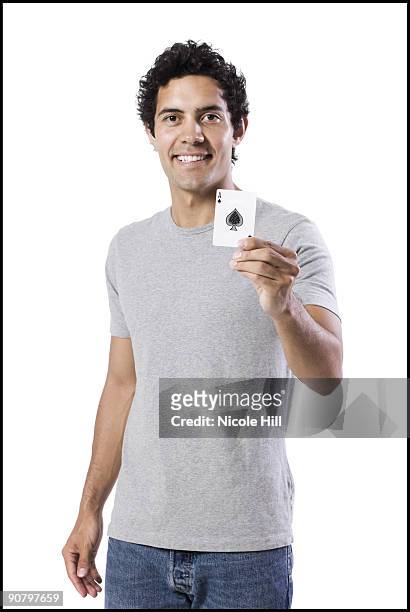 man holding an ace of spades - ace of spades stock pictures, royalty-free photos & images