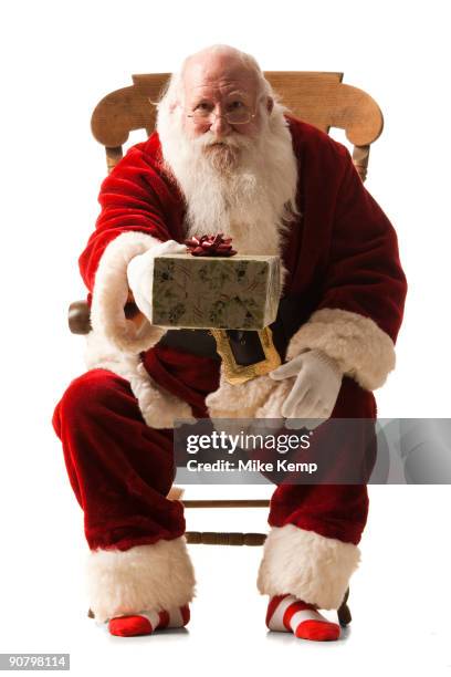 Santa Claus Giving A Present High-Res Stock Photo - Getty Images