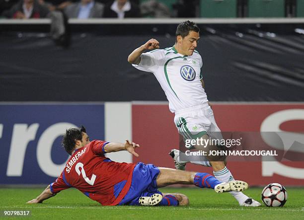 Moskva's Lithuanian defender Deividas Semberas and Wolfsburg's defender Marcel Schaefer vie for the ball during the UEFA Champions League group B...