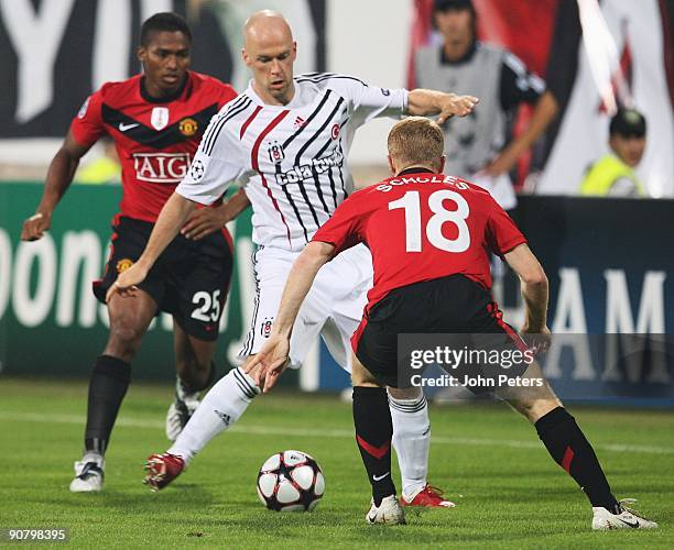Paul Scholes of Manchester United challenges Fabian Ernst of Besiktas during the UEFA Champions League match between Besiktas and Manchester United...