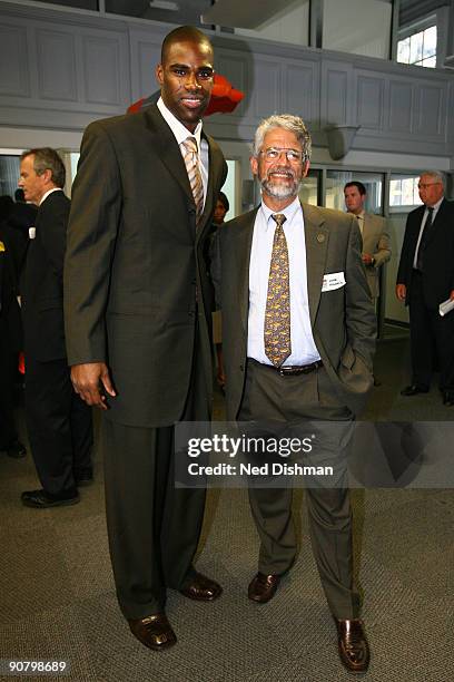 Antawn Jamison of the Washington Wizards and the Director of the White House Office of Science and Technology Policy John Holdren pose for a photo...