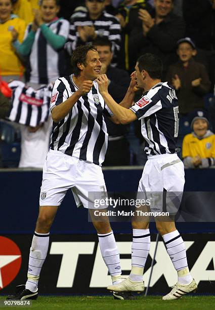 Jonas Olsson of West Bromwich Albion celebrates his goal with team mate Graham Dorrans during the Coca-Cola Championship match between West Bromwich...