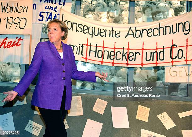 German Chancellor Angela Merkel gestures during her visit at the forum of Contemporary History Leipzig during an election rally on September 15, 2009...