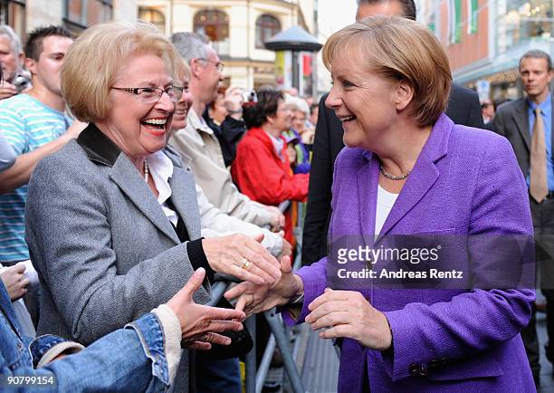 German Chancellor Angela Merkel of the Christian Democratic Union greets supporters during her election campaign rally in the historic 'Rheingold'...