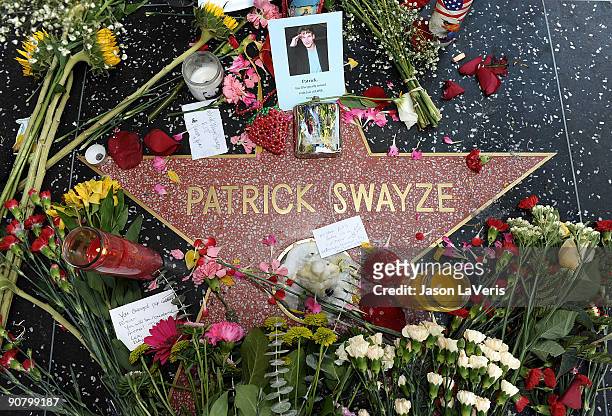 Flowers are left on Patrick Swayze's star on the Hollywood Walk of Fame after his death on September 15, 2009 in Hollywood, California.