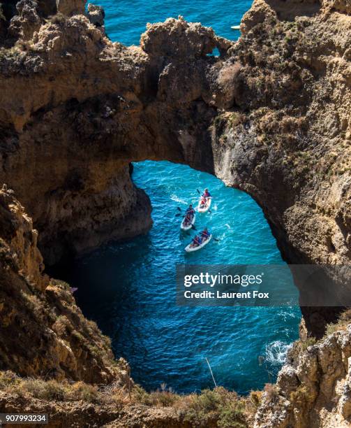 algarve sea caves - lagos portugal stockfoto's en -beelden