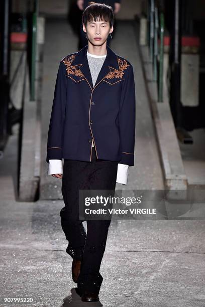 Model walks the runway during the Dries Van Noten Menswear Fall/Winter 2018-2019 show as part of Paris Fashion Week on January 18, 2018 in Paris,...