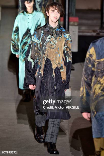 Model walks the runway during the Dries Van Noten Menswear Fall/Winter 2018-2019 show as part of Paris Fashion Week on January 18, 2018 in Paris,...