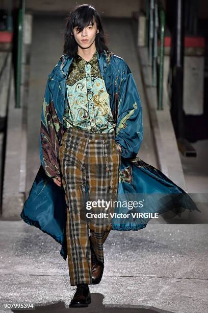 Model walks the runway during the Dries Van Noten Menswear Fall/Winter 2018-2019 show as part of Paris Fashion Week on January 18, 2018 in Paris,...