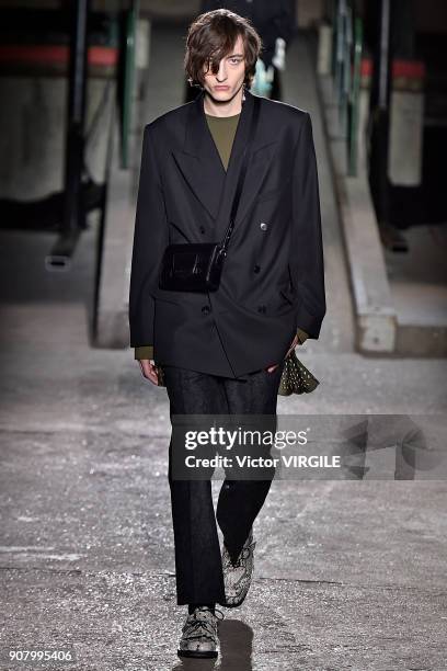 Model walks the runway during the Dries Van Noten Menswear Fall/Winter 2018-2019 show as part of Paris Fashion Week on January 18, 2018 in Paris,...