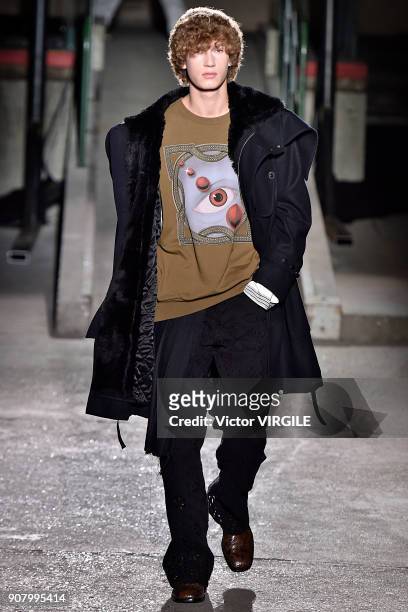 Model walks the runway during the Dries Van Noten Menswear Fall/Winter 2018-2019 show as part of Paris Fashion Week on January 18, 2018 in Paris,...