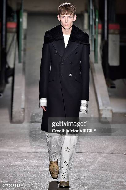 Model walks the runway during the Dries Van Noten Menswear Fall/Winter 2018-2019 show as part of Paris Fashion Week on January 18, 2018 in Paris,...