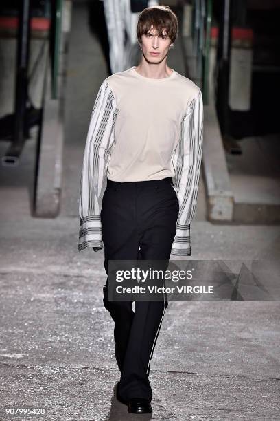 Model walks the runway during the Dries Van Noten Menswear Fall/Winter 2018-2019 show as part of Paris Fashion Week on January 18, 2018 in Paris,...