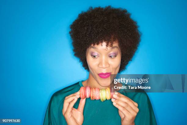 woman looking at macarons - offbeat stock pictures, royalty-free photos & images