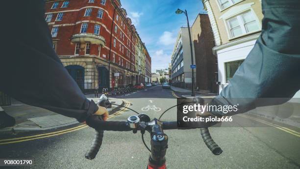 pov bicycle riding: commuter with road racing bike in london - point of view stock pictures, royalty-free photos & images