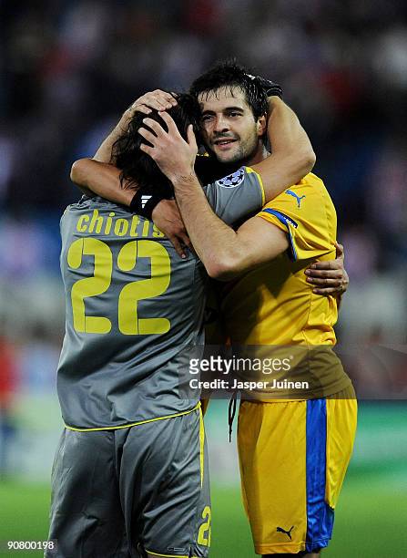 Boban Grncarov of APOEL FC celebrates with goalkeeper Dionisios Chiotis at the end of the Champions League group D match between Atletico Madrid and...