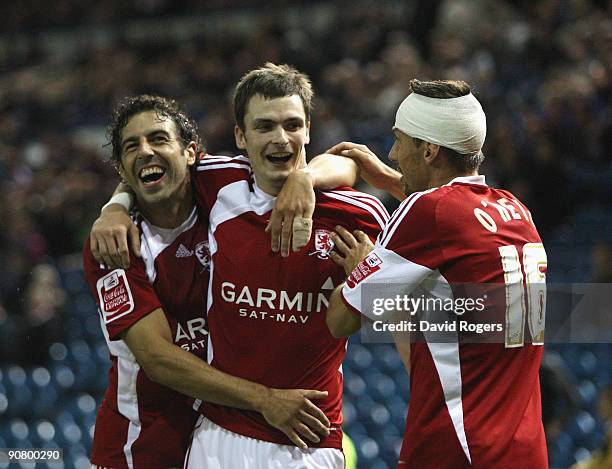 Adam Johnson of Middlesbrough celebrates with team mates Julio Arca and Gary O'Neil after scoring his second goal during the Coca- Cola Championship...